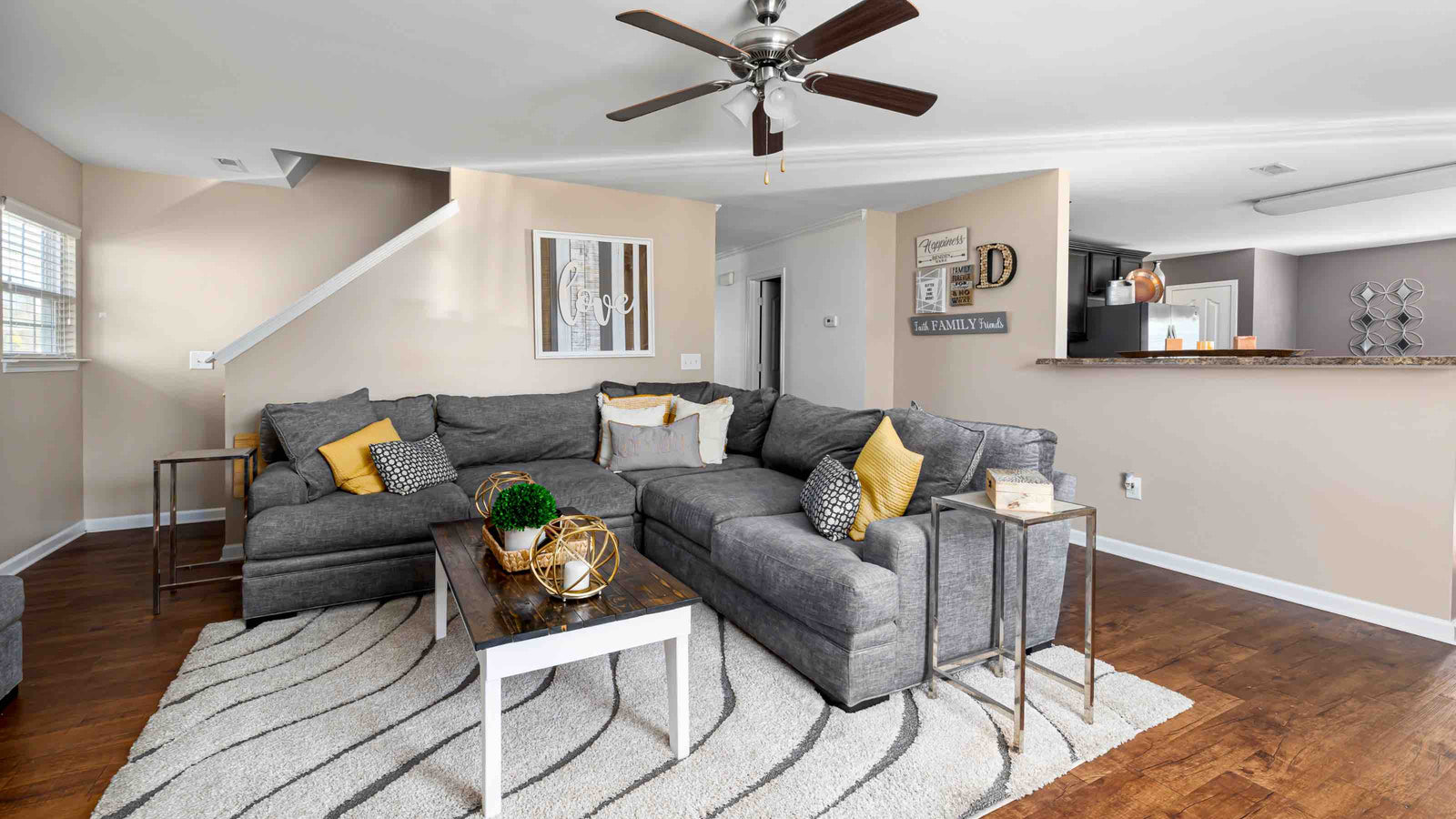 A spacious living room with a grey linen corner sofa