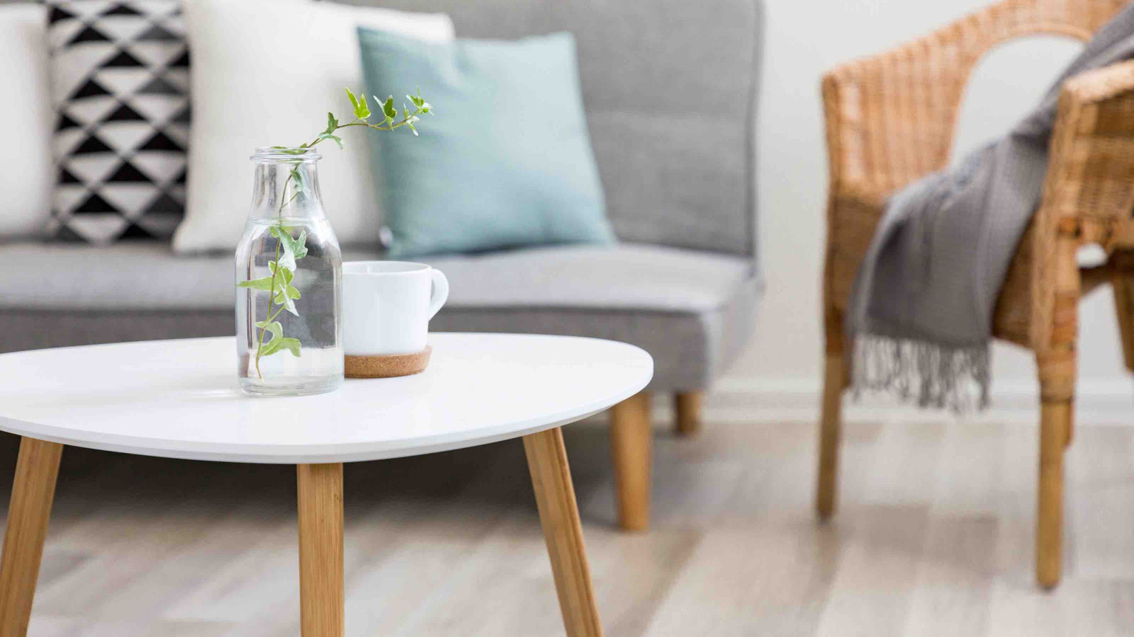 a-white-stone-coffee-table-with-wood-legs