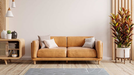 blog-image-A-modern-living-room-adorned-with-a-classic-brown-faux-leather-sofa-exemplifying-the-allure-of-faux-leather-furniture