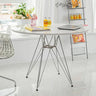 Industrial-round-dining-table-with-Chrome-steel-legs-and-white-high-gloss-tabletop