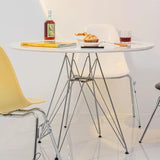 Industrial-round-dining-table-with-Chrome-steel-legs-and-white-high-gloss-tabletop