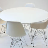 Industrial-round-dining-table-with-Chrome-steel-legs-and-white-high-gloss-tabletop