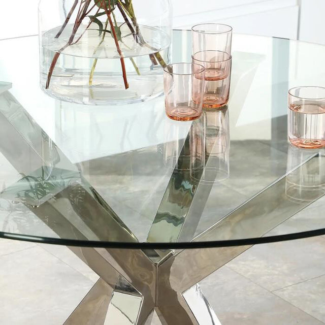 Industrial-round-tempered-glass-dining-table-with-chrome-stainless-steel-base-110cm