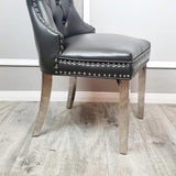 Luxury-dark-grey-leather-dining-chairs-chrome-legs-knocker-back