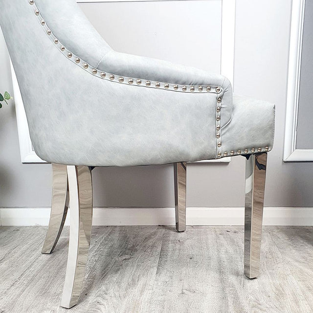 Luxury-light-grey-leather-dining-chairs-chrome-legs-lion-knocker