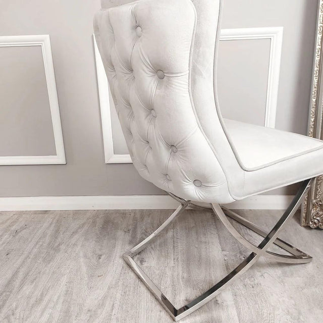 Luxury-light-grey-velvet-dining-chairs-chrome-cross-legs