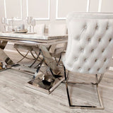 Luxury-light-grey-velvet-dining-chairs-chrome-cross-legs