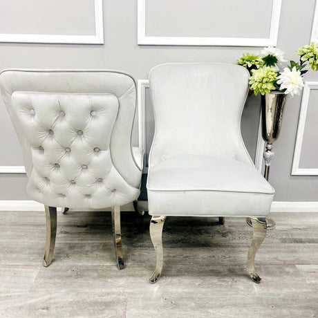 Luxury-light-grey-velvet-dining-chairs-chrome-legs-button-back