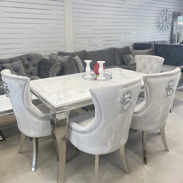 Luxury-light-grey-velvet-dining-chairs-chrome-legs-lion-knocker