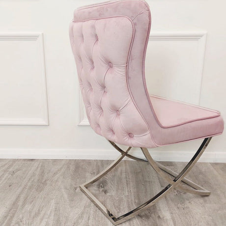 Luxury-pink-velvet-dining-chairs-chrome-cross-legs