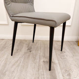 Minimalist-grey-leather-dining-chairs-metal-legs