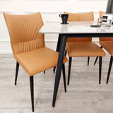 Minimalist-orange-leather-dining-chairs-metal-legs