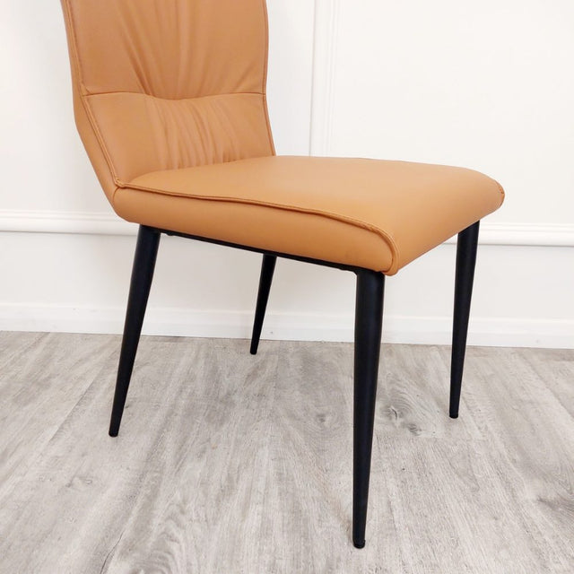 Minimalist-orange-leather-dining-chairs-metal-legs