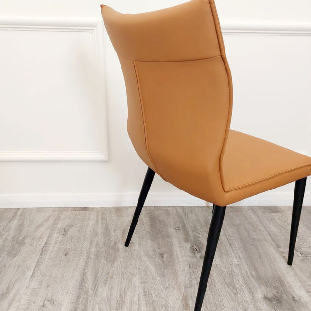 Minimalist-orange-leather-dining-chairs-metal-legs