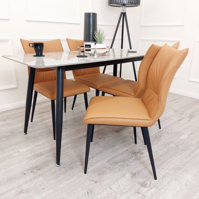 Minimalist-orange-leather-dining-chairs-metal-legs