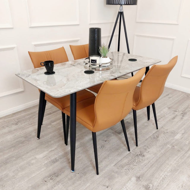 Minimalist-orange-leather-dining-chairs-metal-legs