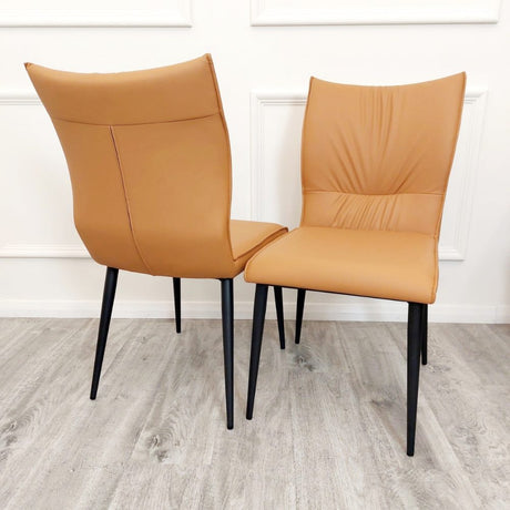 Minimalist-orange-leather-dining-chairs-metal-legs