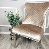 Modern-beige-velvet-lion-knocker-dining-chairs-chrome-legs-quilted-back