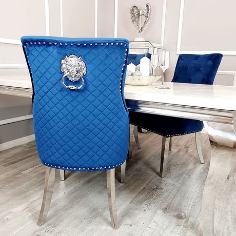 Modern-blue-velvet-dining-chairs-chrome-legs-lion-knocker-quilted-back