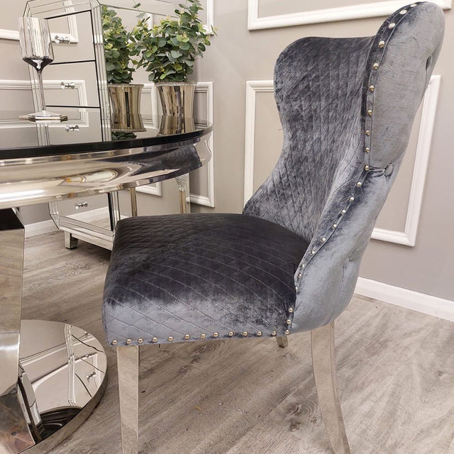 Modern-grey-velvet-lion-knocker-dining-chairs-chrome-legs-quilted-back