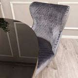 Modern-grey-velvet-lion-knocker-dining-chairs-chrome-legs-quilted-back