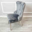 Modern-grey-velvet-lion-knocker-dining-chairs-chrome-legs-quilted-back