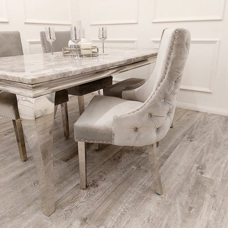 Modern-light-grey-velvet-dining-chairs-chrome-legs-button-back