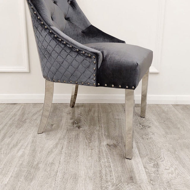 Modern-shimmer-grey-velvet-dining-chairs-chrome-legs-lion-knocker-quilted-back