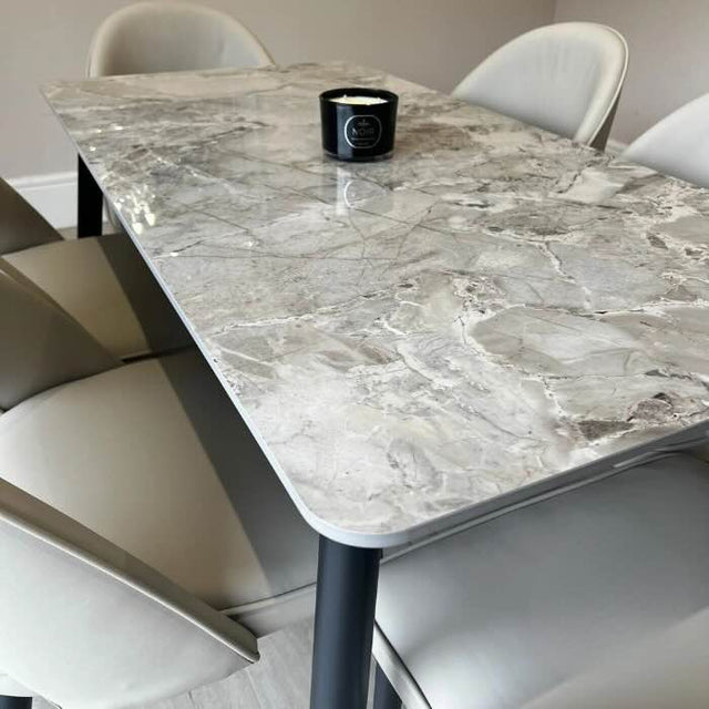 140cm rectangular grey marble dining table and 6 cream leather dining chairs