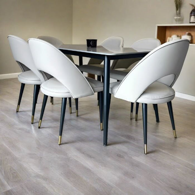 140cm rectangular grey marble dining table and 6 cream leather dining chairs