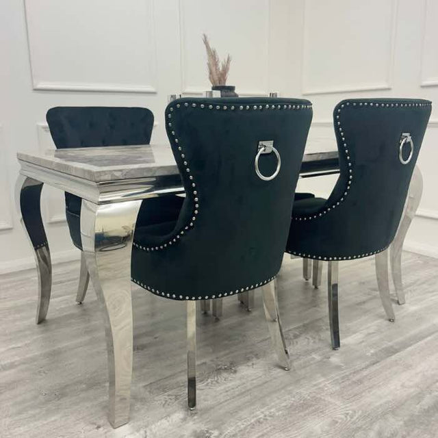 Luxury-black-velvet-dining-chairs-chrome-legs-lion-knocker