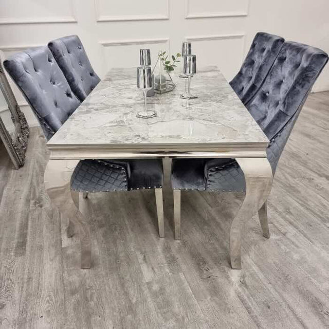 modern-grey-marble-dining-table-with-stainless-steel-frame-and-classic-velvet-dining-chairs-with-lion-knocker-dining-table-set-for-6-to-8