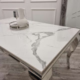 modern-white-marble-dining-table-with-stainless-steel-frame-and-classic-velvet-dining-chairs-with-lion-knocker-dining-table-set-for-6