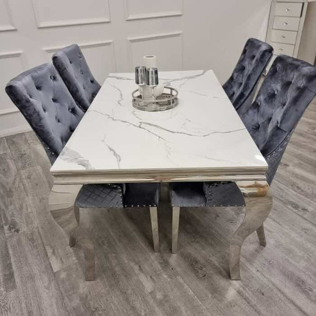 modern-white-marble-dining-table-with-stainless-steel-frame-and-classic-velvet-dining-chairs-with-lion-knocker-dining-table-set-for-6